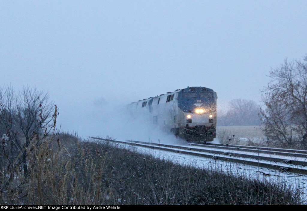 AMTK 201 leads #7 out of its own blizzard toward Springdale Rd.